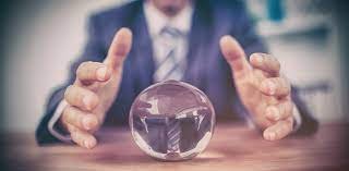 a person holding a crystal ball, representing the uncertainty of the future.